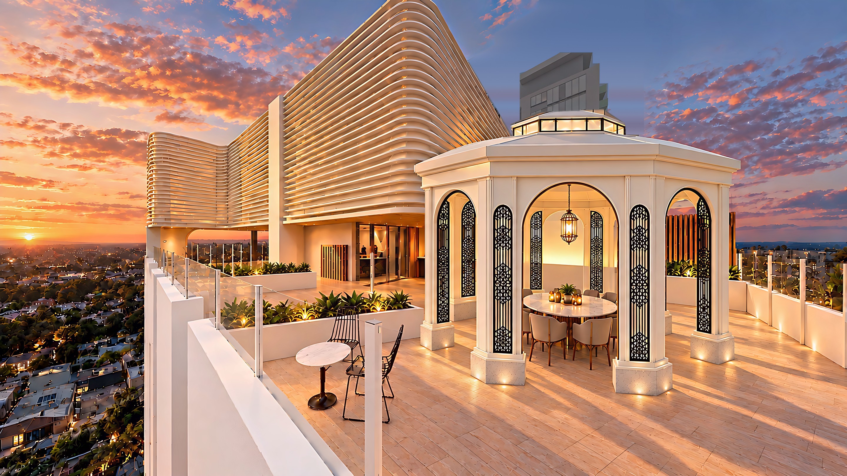 Wide view of the New Dawn rooftop terrace at sunset, with an octagonal pavilion of cream columns, arched openings and black filigree panels over the dining table, two planters running out from the left wall and green planting along the back wall.
