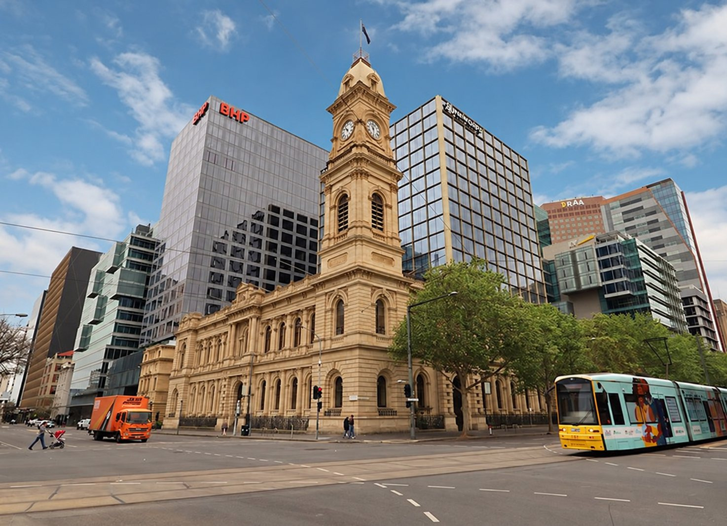The GPO clock tower on King William Street, with a tram passing.