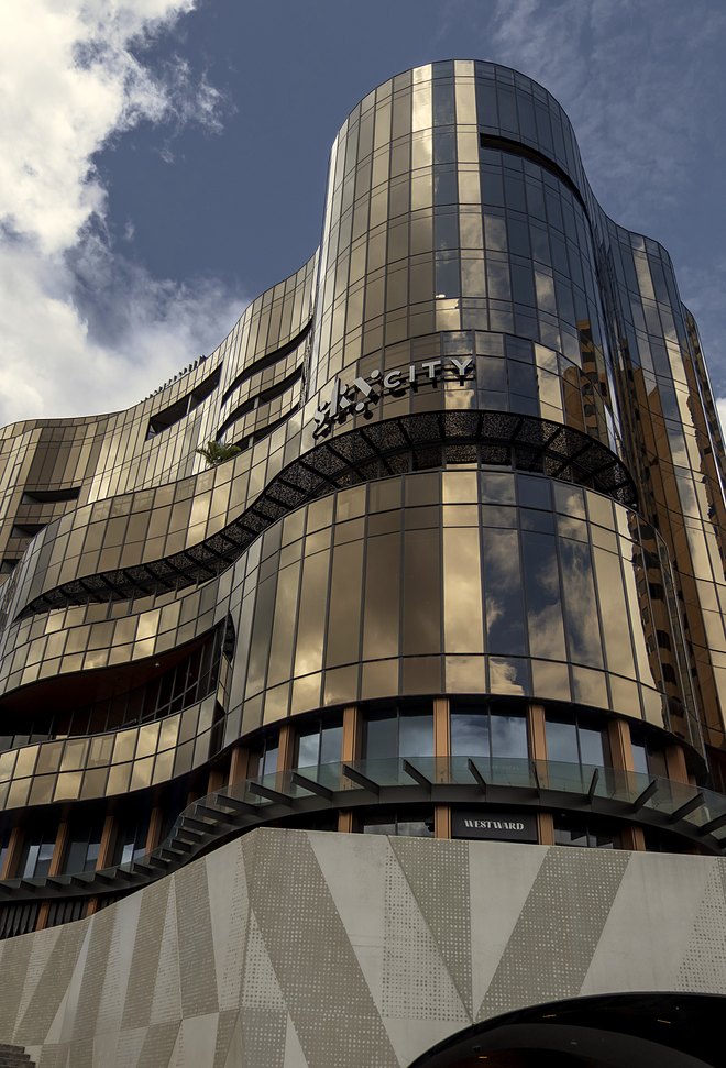 The curved bronze glass facade of SkyCity Adelaide.